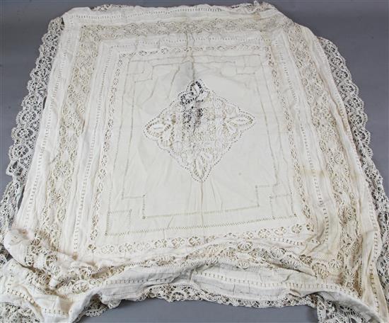 A quantity of mixed embroidered linens and a bed cover.